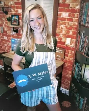 Ammi Williams - A.W. Styles Ammi Williams holding an A.W. Styles sign